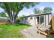 Charming backyard with a patio and chairs, perfect for outdoor relaxation at 4456 S Washington St, Englewood, CO 80113