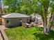 Aerial view of fenced backyard with deck and well manicured lawn at 4456 S Washington St, Englewood, CO 80113