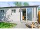 Relaxing backyard patio area with chairs and a slider leading inside at 4456 S Washington St, Englewood, CO 80113