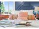Bright bedroom showcasing a tray with glasses and a book on a cozy, well-lit queen-size bed at 4456 S Washington St, Englewood, CO 80113