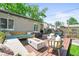 Deck features outdoor seating and fire pit at 4456 S Washington St, Englewood, CO 80113
