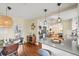 Well-appointed kitchen with a view of the dining area, featuring modern finishes, great for cooking and entertaining at 4456 S Washington St, Englewood, CO 80113