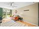 Bright living room with hardwood floors, ceiling fan, and sliding glass door at 4456 S Washington St, Englewood, CO 80113