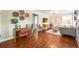 Open-concept living space with hardwood floors, stylish furnishings, and a cozy seating area; great for entertaining at 4456 S Washington St, Englewood, CO 80113