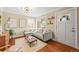 A modern living room features a gray sectional sofa, hardwood floors, and a door that leads to the outside at 4456 S Washington St, Englewood, CO 80113