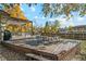 Backyard deck area with wooden table, hot tub and pergola at 9532 W Walden Ave, Littleton, CO 80128