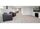 Finished basement with neutral carpet, leather seating, and recessed lighting at 9532 W Walden Ave, Littleton, CO 80128