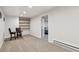 Basement seating area featuring carpet, recessed lighting, and a table with chairs at 9532 W Walden Ave, Littleton, CO 80128