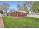 The backyard features lush green grass and privacy fence, perfect for outdoor activities and entertaining at 9580 W 12Th Pl, Lakewood, CO 80215