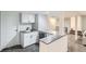 Basement bar with white cabinets, countertop, and sink at 9580 W 12Th Pl, Lakewood, CO 80215
