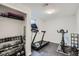 This finished basement has been converted into a home gym, complete with weights, treadmill, and exercise bike at 9580 W 12Th Pl, Lakewood, CO 80215