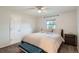 Cozy bedroom featuring a ceiling fan, neutral walls, and a comfortable bed at 9580 W 12Th Pl, Lakewood, CO 80215