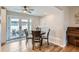 Cozy dining area adjacent to the kitchen, featuring French doors and a ceiling fan for added comfort at 9580 W 12Th Pl, Lakewood, CO 80215