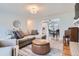 Bright and airy living room that flows into dining area, showcasing hardwood floors and neutral decor at 9580 W 12Th Pl, Lakewood, CO 80215