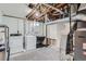 Unfinished basement utility room contains washing machine, dryer, utility sink, and updated furnace at 9580 W 12Th Pl, Lakewood, CO 80215