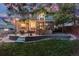 Relaxing backyard with a stone patio and wooden deck, great for outdoor activities and gatherings at 6512 S Taft Way, Littleton, CO 80127