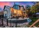 Charming backyard with a stone patio, seating area, and lush landscaping perfect for entertaining at 6512 S Taft Way, Littleton, CO 80127