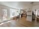 Open dining area with a bay window, deck access, and a view of the outdoors at 6512 S Taft Way, Littleton, CO 80127
