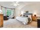 Spacious main bedroom with a large window, sitting area, and neutral color palette at 6512 S Taft Way, Littleton, CO 80127