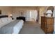 View of main bedroom that showcases furniture and access to other rooms at 6512 S Taft Way, Littleton, CO 80127