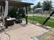 Backyard with a pergola-covered seating area, lush lawn, and privacy fence at 1207 Joliet St, Aurora, CO 80010