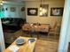 Cozy dining room with unique decor, hardwood floors, and a view into the living room at 1207 Joliet St, Aurora, CO 80010