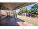 Spacious backyard deck featuring outdoor dining, with a view of the fenced backyard and play set at 6526 N Windfield Ave, Parker, CO 80134