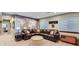 Finished basement with a comfortable seating area, decorative world map mural, and aviation themed decor at 6526 N Windfield Ave, Parker, CO 80134