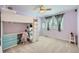 Fun bedroom with loft bed and study space featuring colorful decor and ample natural light at 6526 N Windfield Ave, Parker, CO 80134