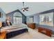 Vaulted bedroom with lots of natural light and wood accents at 6526 N Windfield Ave, Parker, CO 80134