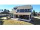 Exterior of home featuring a large deck, fire pit, and outdoor seating at 6526 N Windfield Ave, Parker, CO 80134