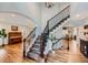Elegant foyer with hardwood floors, a grand staircase, and a decorative chandelier at 6526 N Windfield Ave, Parker, CO 80134