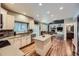 Open concept kitchen with stainless appliances and eat in space, hardwood flooring at 6526 N Windfield Ave, Parker, CO 80134