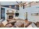 Open concept living space with hardwood floors, fireplace, and comfortable seating at 6526 N Windfield Ave, Parker, CO 80134