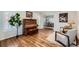 Cozy living room featuring hardwood floors, comfortable seating, and ample natural light at 6526 N Windfield Ave, Parker, CO 80134