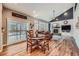 Open concept living space with high ceilings, fan, fireplace, and hardwood flooring at 6526 N Windfield Ave, Parker, CO 80134