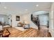 Bright living room with hardwood floors, a cozy seating area, and an elegant arched entryway at 6526 N Windfield Ave, Parker, CO 80134