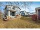 Backyard with a hot tub, patio, and grass at 722 Hutchinson St, Louisville, CO 80027