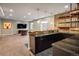 Finished basement bar area with dark countertops, accent lighting, and shelving at 722 Hutchinson St, Louisville, CO 80027