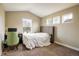 Bright bedroom with neutral walls, carpet, and natural light from three windows at 722 Hutchinson St, Louisville, CO 80027