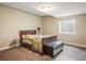 Bedroom with a sleigh bed and natural lighting at 722 Hutchinson St, Louisville, CO 80027
