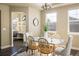 Cozy dining area with bright windows, a stylish chandelier, and comfortable seating at 722 Hutchinson St, Louisville, CO 80027