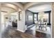 Stylish dining room with modern lighting and a view into the living room at 722 Hutchinson St, Louisville, CO 80027