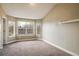 Bright and airy bedroom with large windows and neutral carpeting at 722 Hutchinson St, Louisville, CO 80027