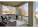 Inviting front porch with comfortable seating and a view of the neighborhood at 722 Hutchinson St, Louisville, CO 80027