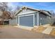 A well-maintained detached garage with ample parking space and a paved driveway at 722 Hutchinson St, Louisville, CO 80027
