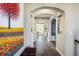 Elegant hallway featuring arched entryways and hardwood floors at 722 Hutchinson St, Louisville, CO 80027