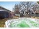Relaxing hot tub in a fenced backyard featuring bare trees in a quiet neighborhood at 722 Hutchinson St, Louisville, CO 80027