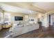 Comfortable living room with a fireplace, large TV, and hardwood floors at 722 Hutchinson St, Louisville, CO 80027