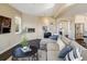 Spacious living room featuring a cozy fireplace and an open floor plan at 722 Hutchinson St, Louisville, CO 80027